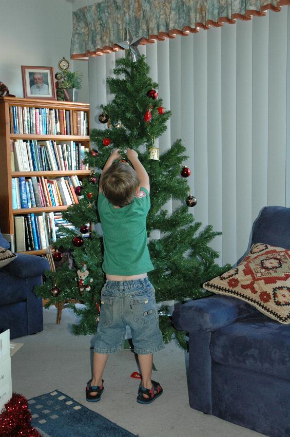 Jake helping Yvonne decorate Illawong Christmas tree