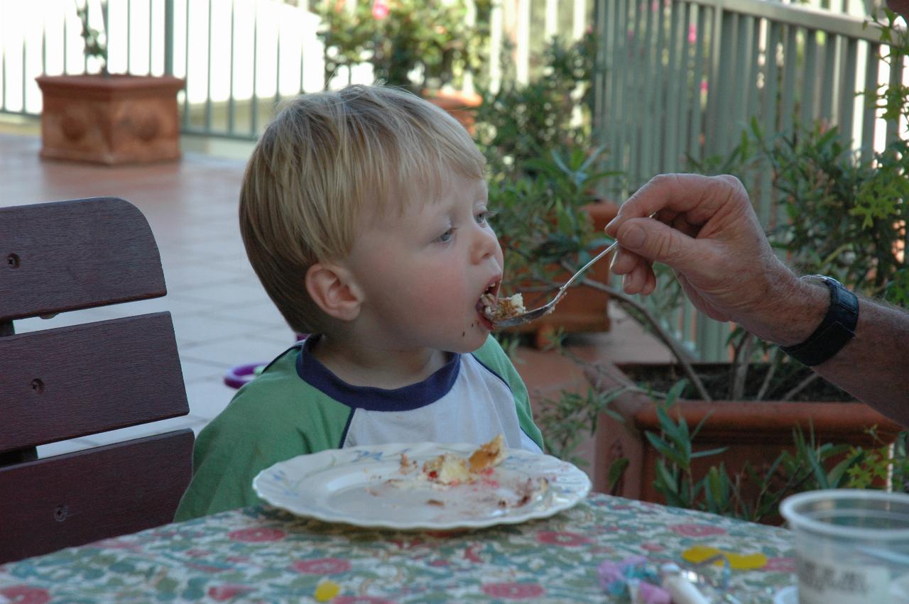 Flynn eating the cake at Michelle's quickie birthday party