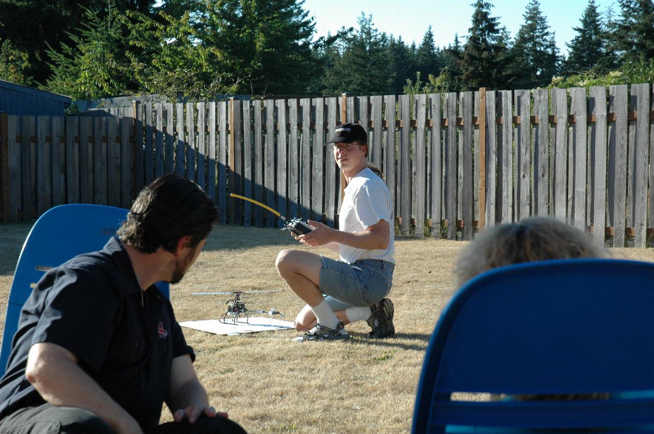 Seth and his RC helicopter; Joe Warren looking on