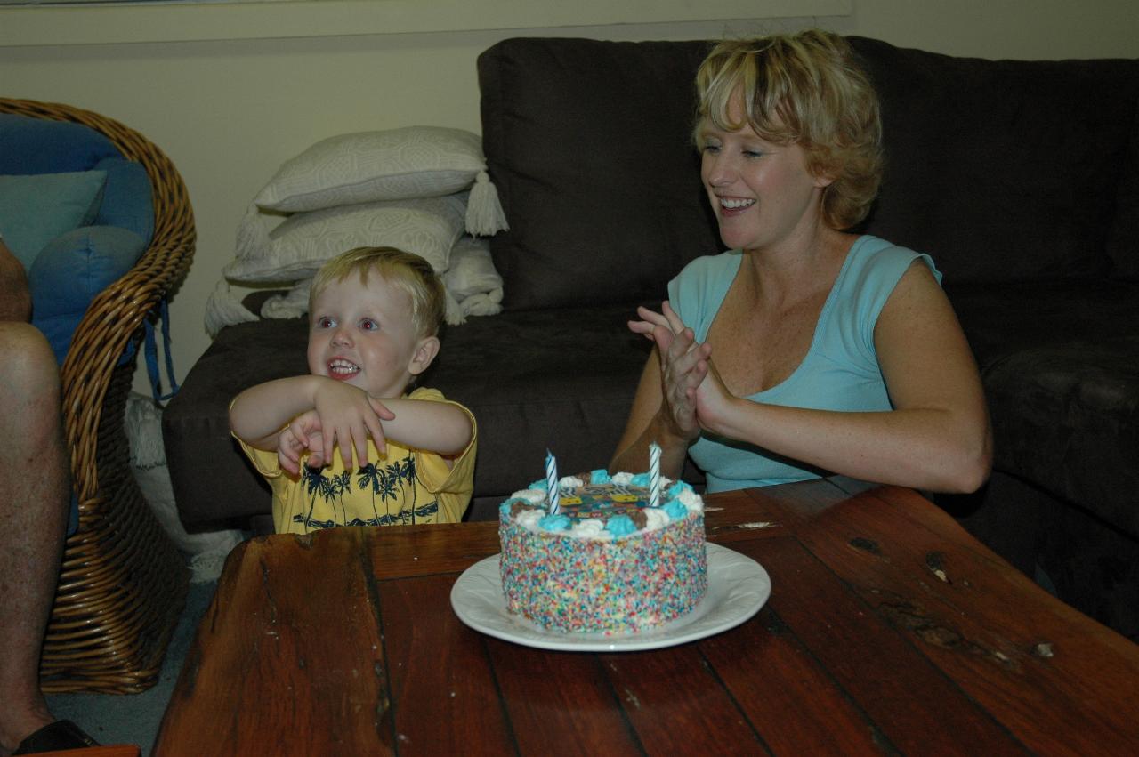 Clapping at blowing out ALL the candles on the cake; Flynn and Michelle Crofts