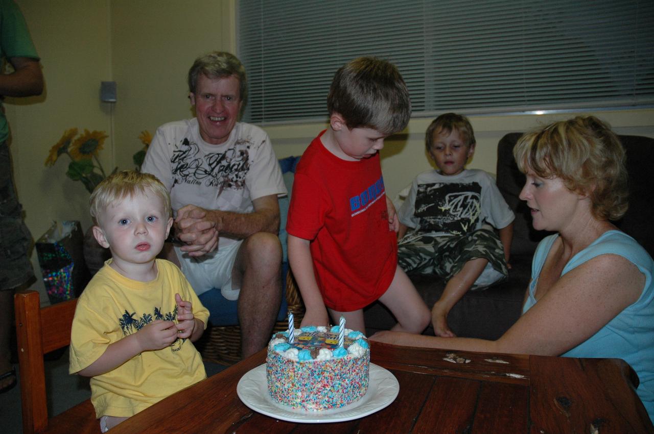 Flynn with his second birthday cake; Peter, Jake and Tynan and Michelle in the background