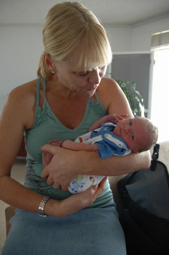 Cooper in Kelly's arms - getting ready for a walk to the beach