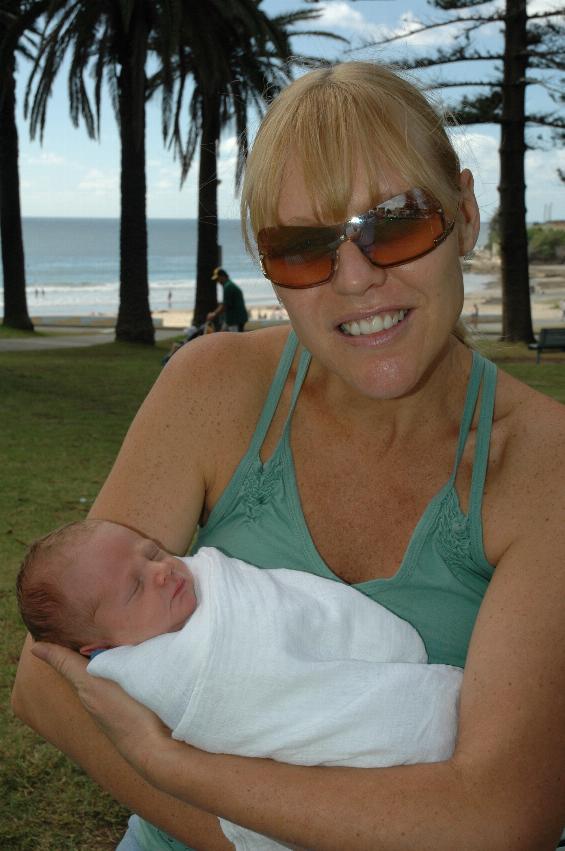 Kelly and Cooper on his first visit to the beach - and only 6 days old at Cronulla Park