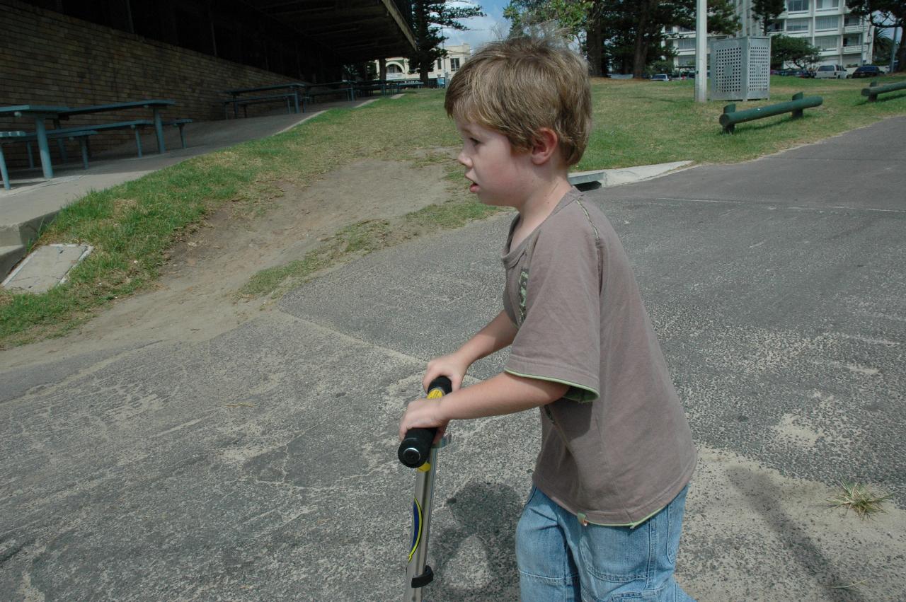 Jake Crofts zooming by on his scooter at Cronulla Park