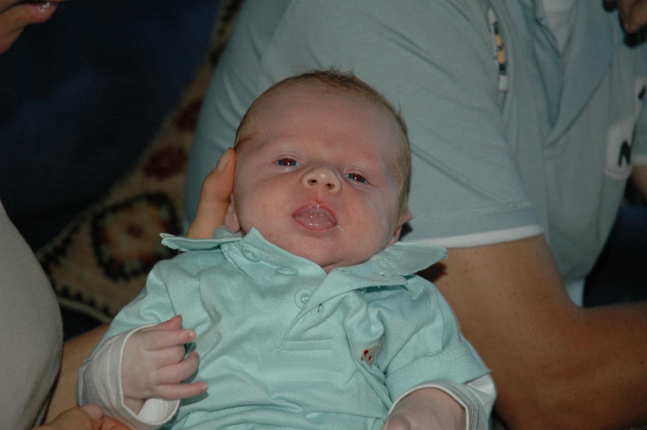 Baby Cooper Wallace in his mum's arms at Illawong family dinner night