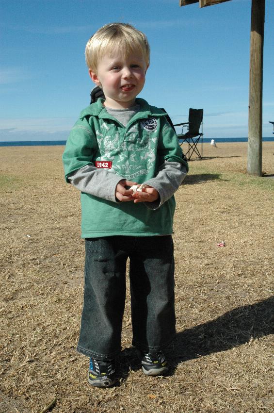 Mother's Day at Thirroul: Flynn Crofts with his shells collected from the beach