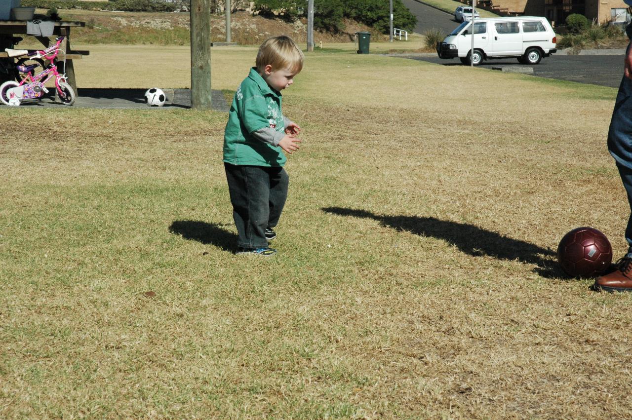 Mother's Day at Thirroul: Flynn learning to kick a ball