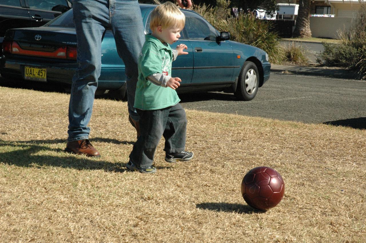 Mother's Day at Thirroul: Flynn learning to kick a ball