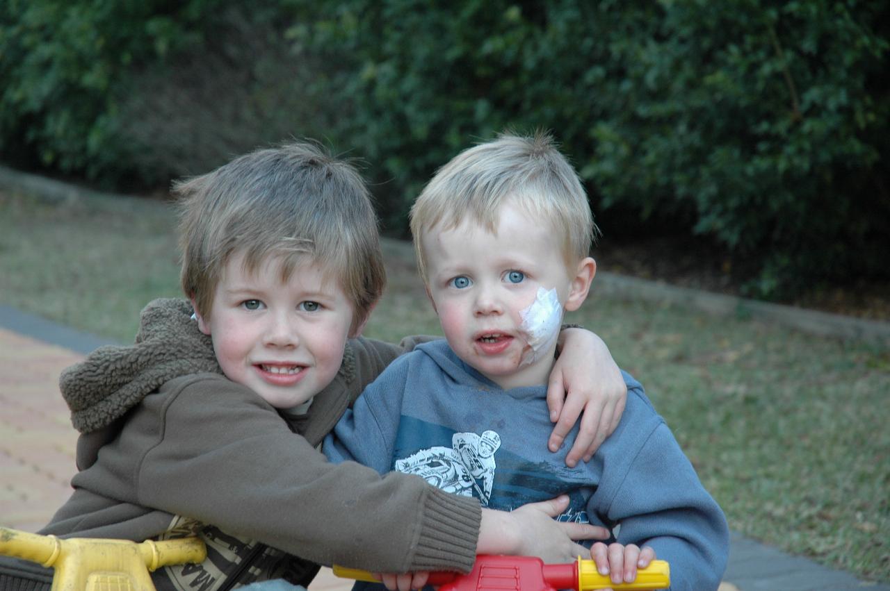 Jake and Flynn Crofts at home the day after Flynn's cyst was removed