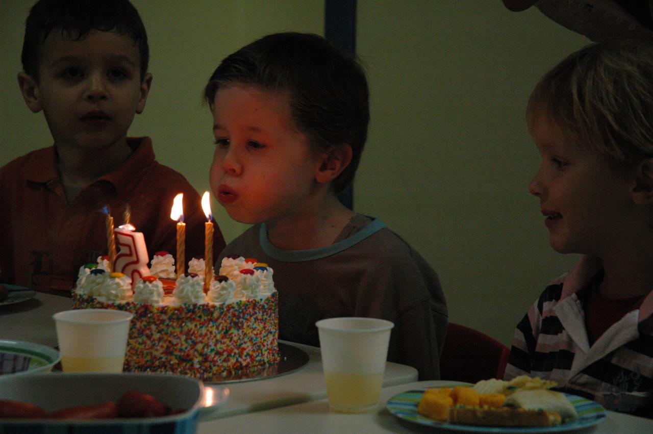 Jake's birthday at Crazy Maze: Jake blowing the candles out