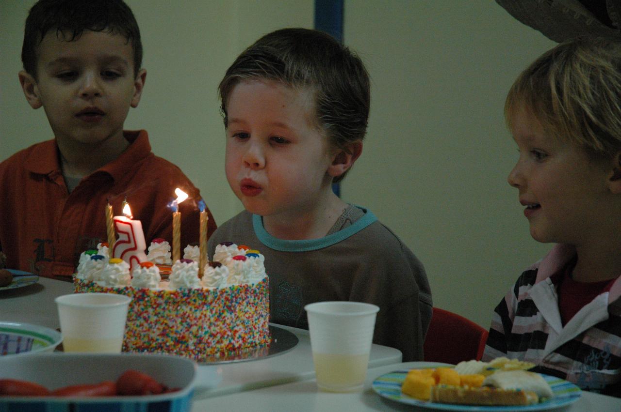 Jake's birthday at Crazy Maze: Jake blowing the candles out