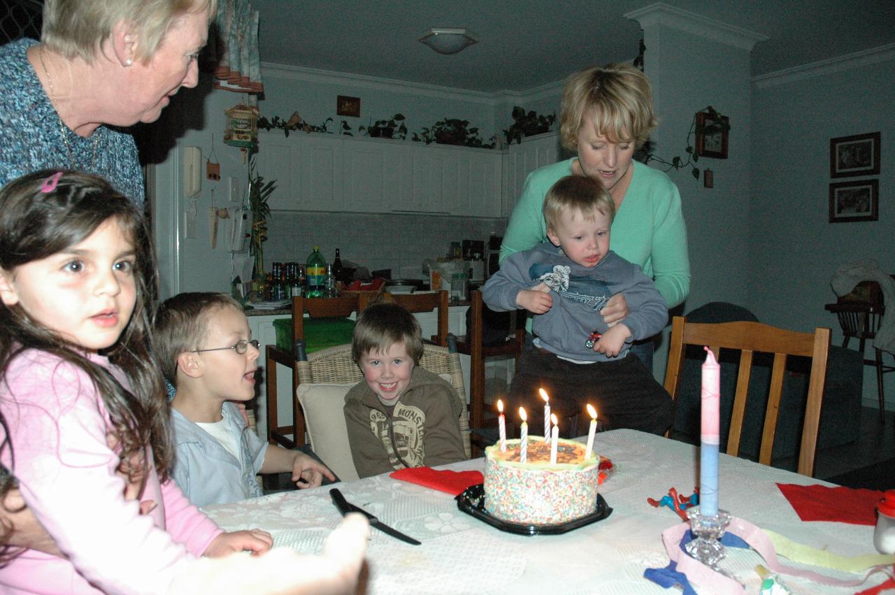 Jake's 5th birthday (Illawong): Taylor, Yvonne, Tynan, Jake, Flynn and Michelle with the candles lit