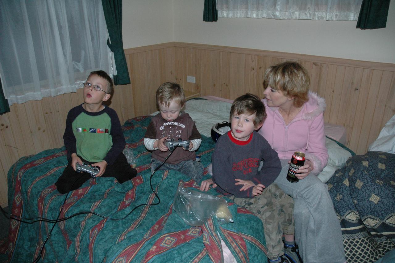 Tynan, Flynn and Jake playing computer games with Michelle at Bendalong for Cooper's Baptism