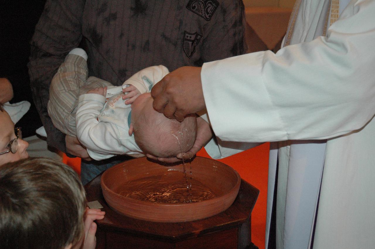 Father Francis baptising Cooper (Father)