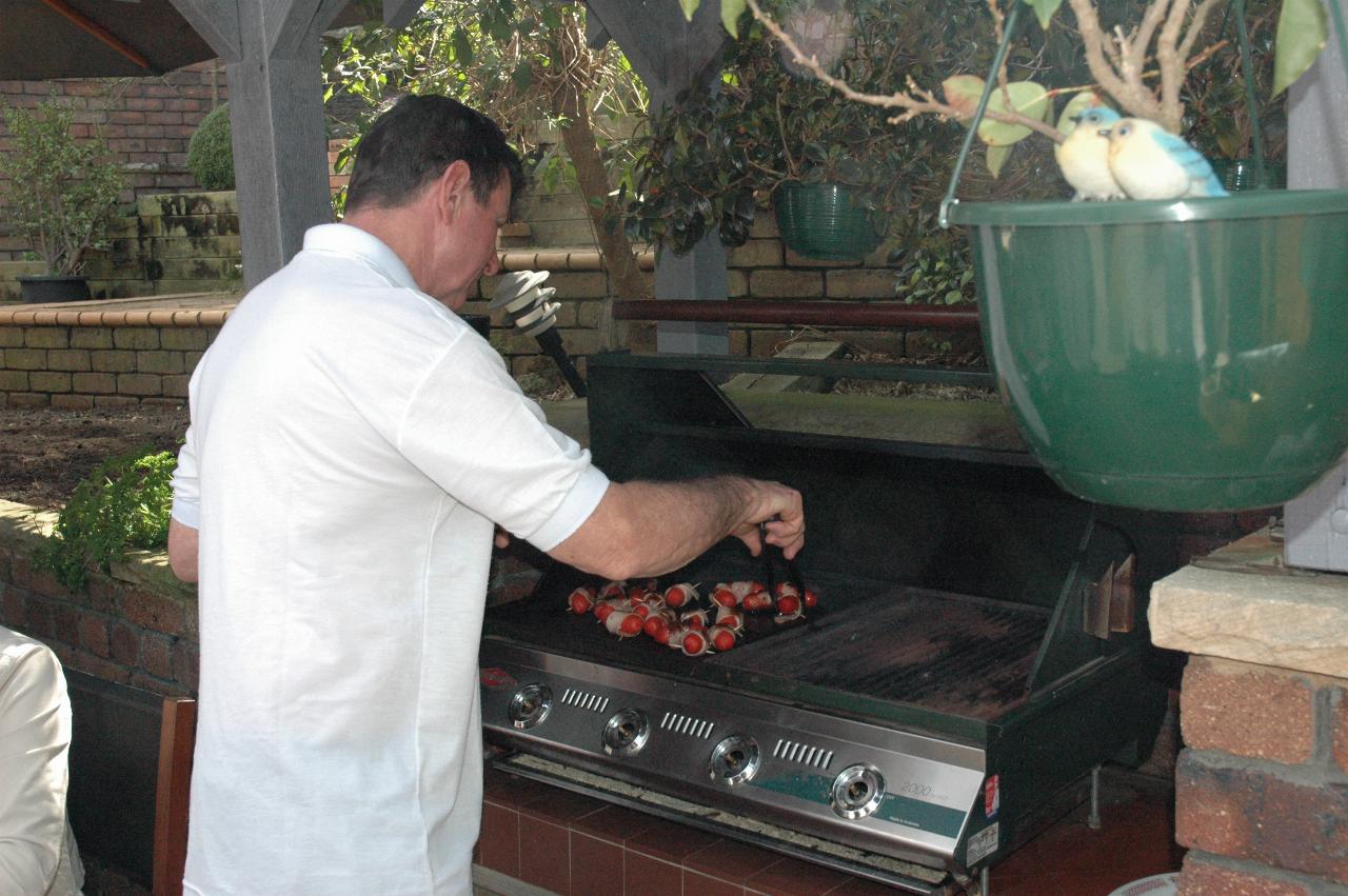 Peter Currey tending the barbecue