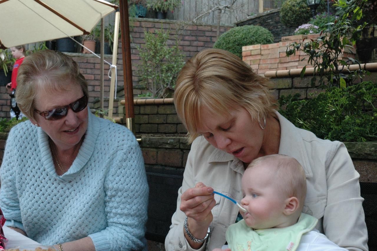 Kelly feeding baby Cooper at Currey's, Engadine; Yvonne on left