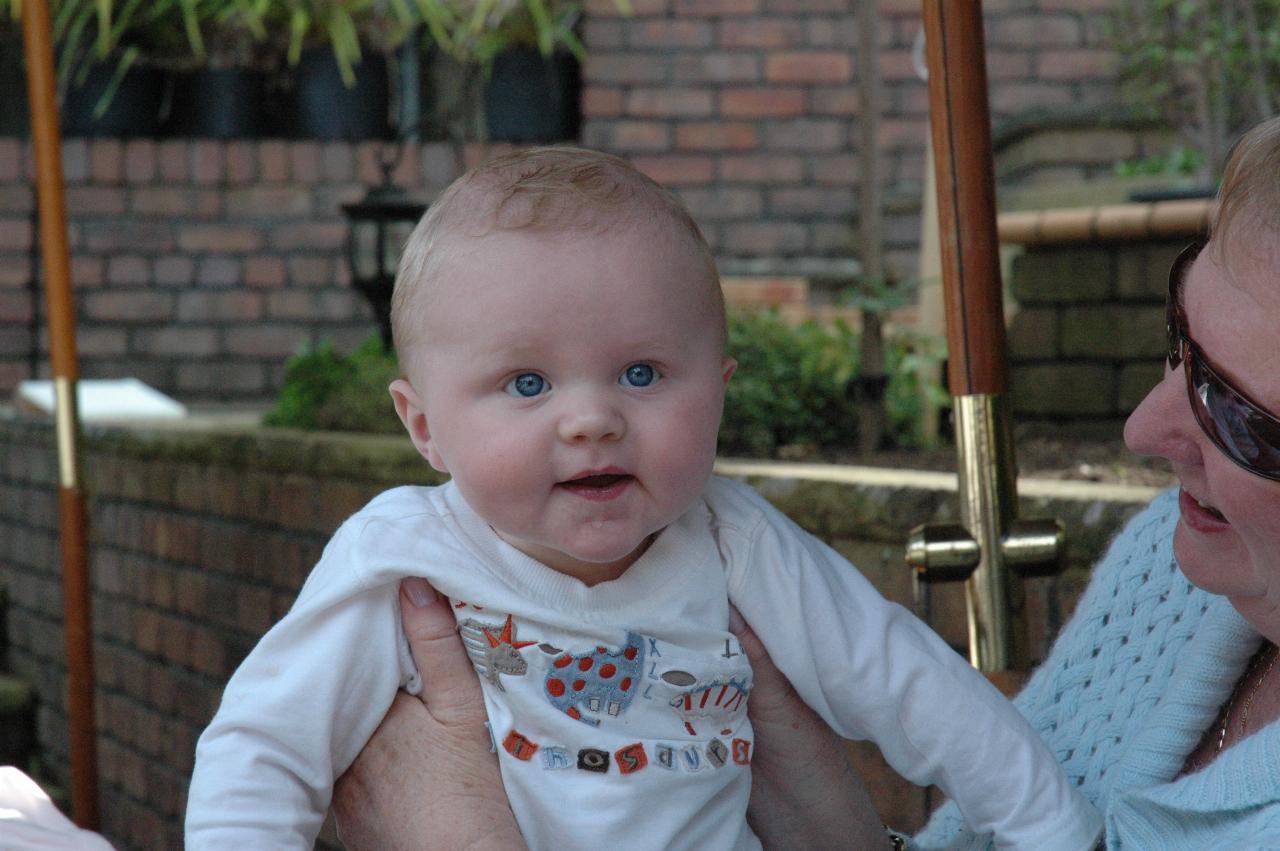 Cooper in Yvonne's hands at Currey's triple birthday treat, Engadine