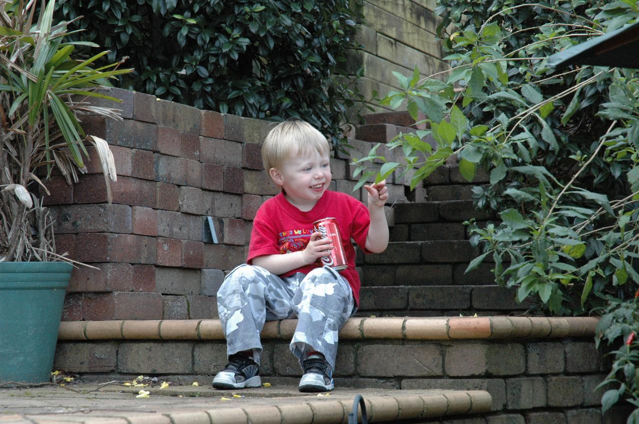 Flynn drinking his first can of Coke at Currey's, Engadine