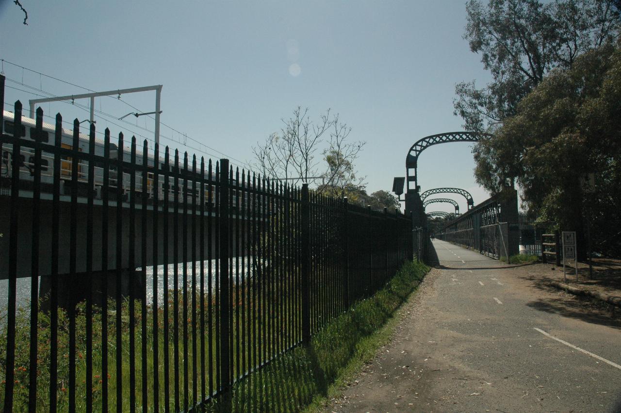 Train passing over Como bridge as seen from old train bridge (now walking bridge)