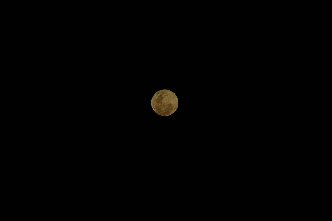 Moon rise over Padstow.  Full moon at apogee; nearby house some photos