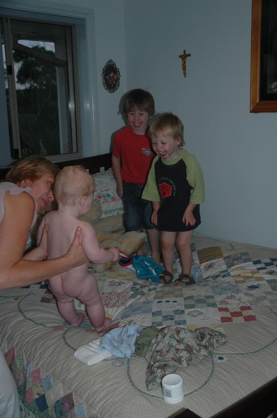 Cooper after his bath with Kelly and Jake (l) and Flynn