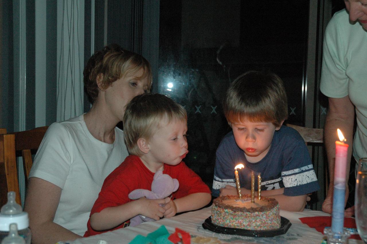 Jake blowing out the candles at Michelle's birthday party at Illawong