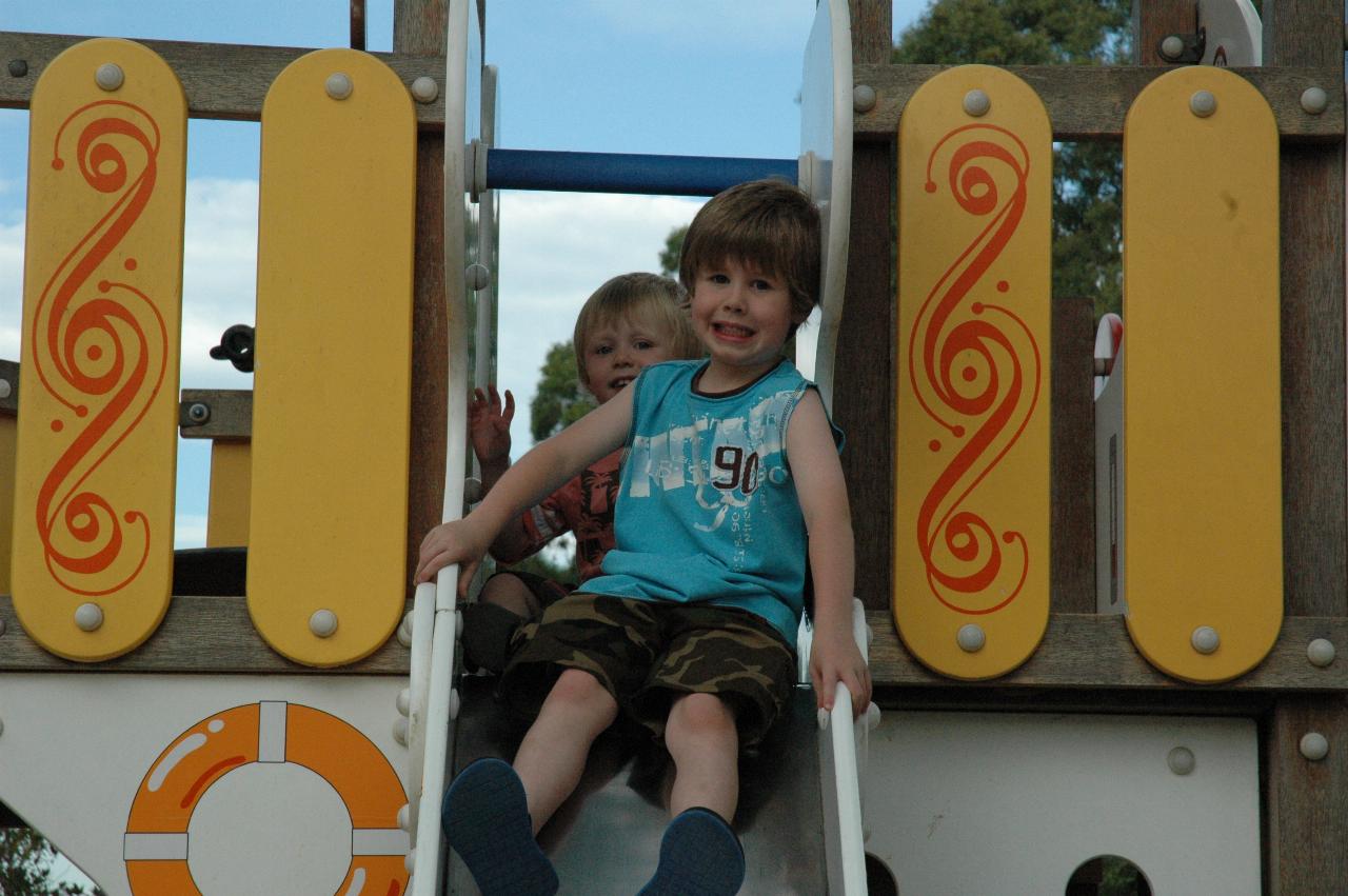 Jake and Flynn on the slippery dip at Como Pleasure Grounds