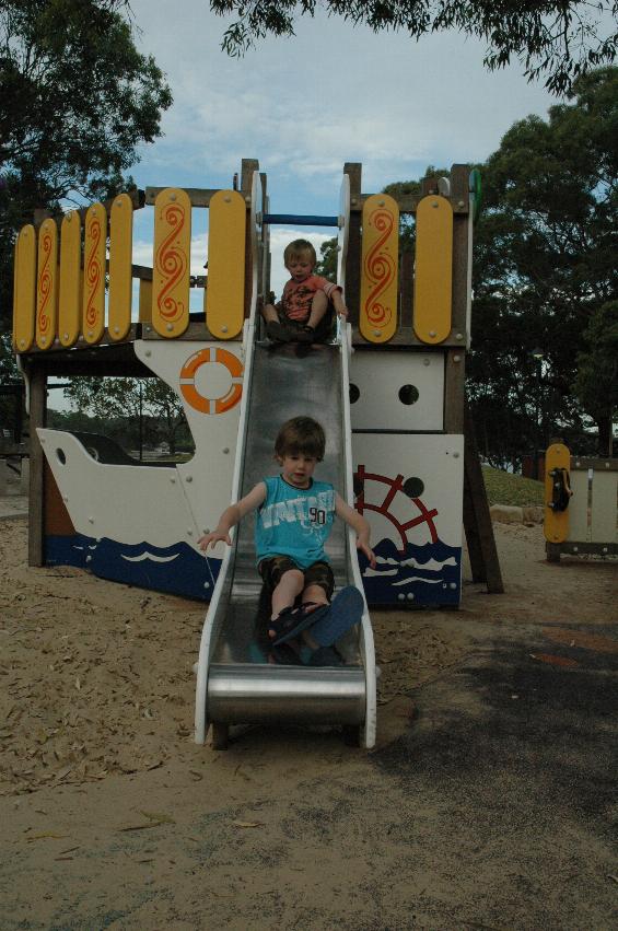 Jake and Flynn on the slippery dip at Como Pleasure Grounds