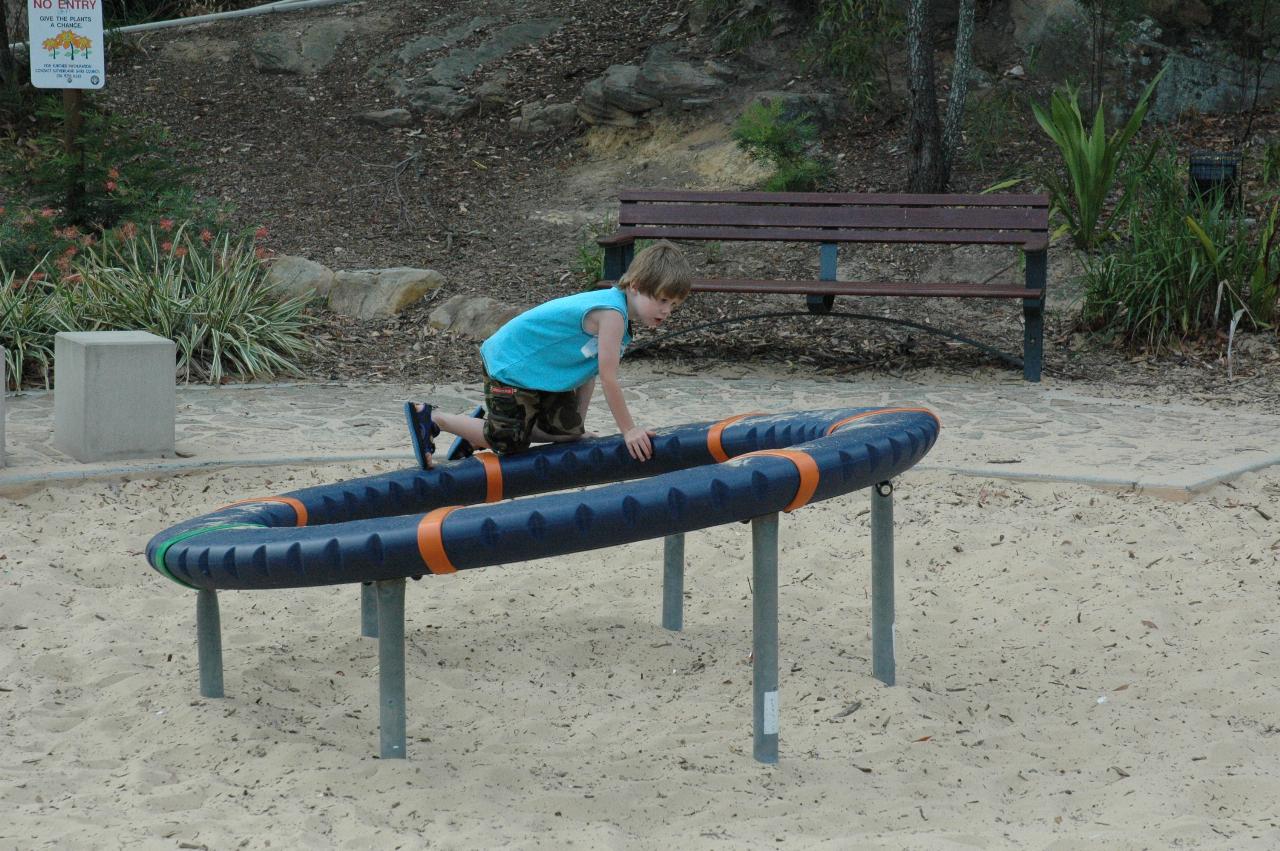 Jake on the merry go round at Como Pleasure Grounds for family picnic