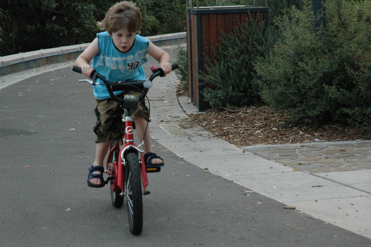 Jake riding his bike at Como Pleasure Grounds for family picnic