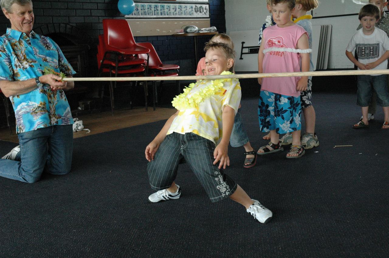 Tynan's 7th birthday party: Tynan doing the Limbo Rock