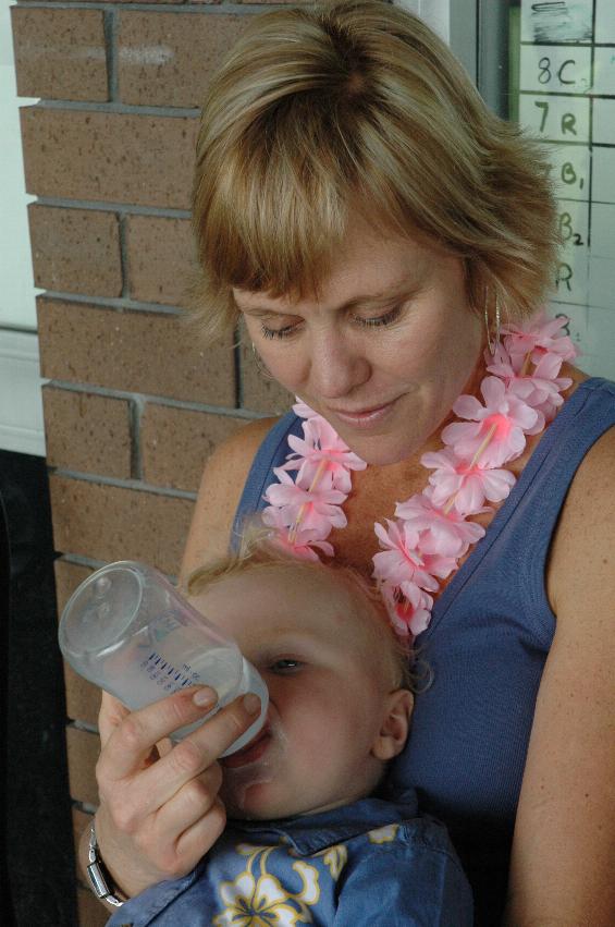 Tynan's 7th birthday party: Kelly feeding Cooper - babies get hungry too