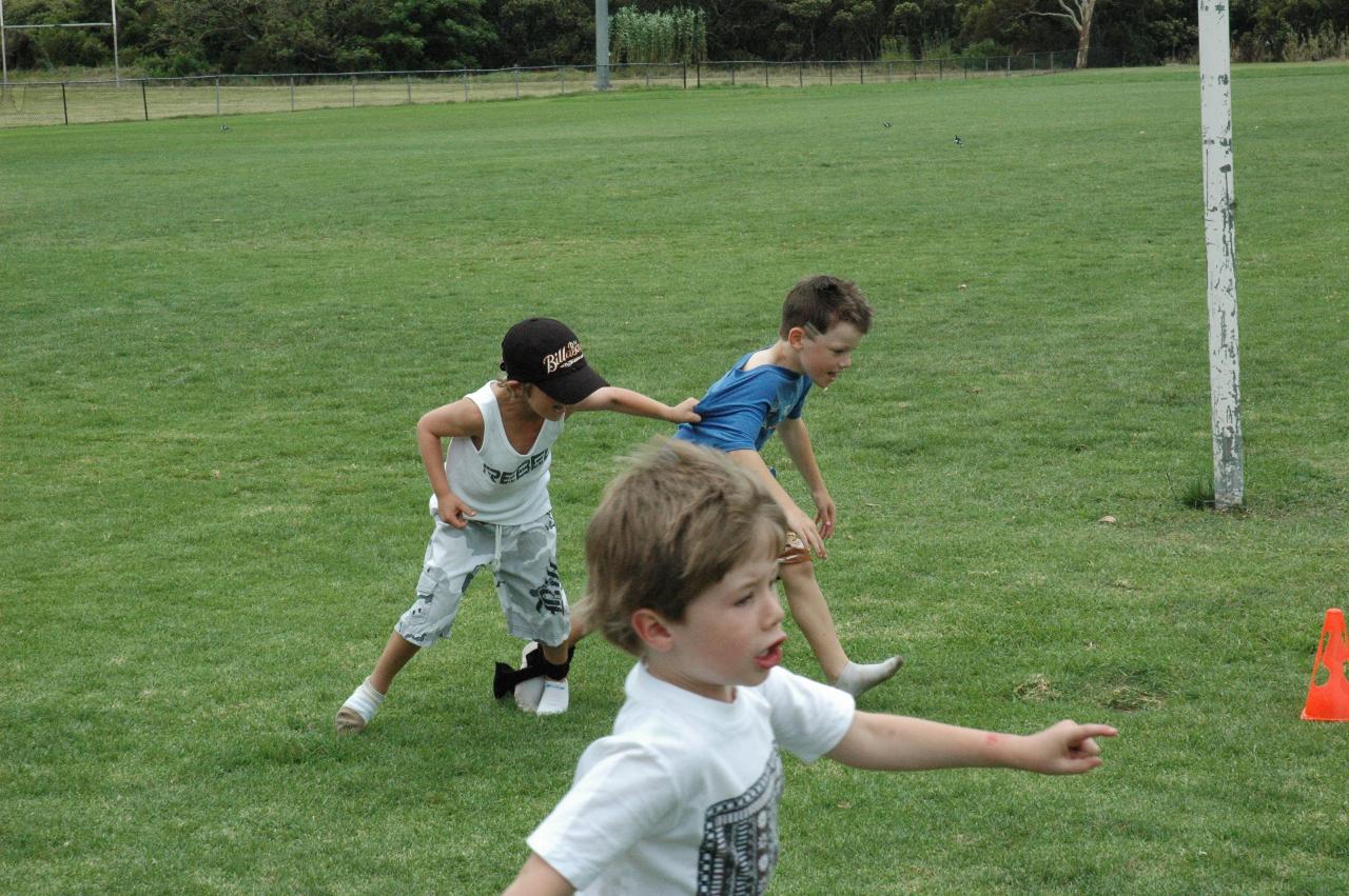 Tynan's 7th birthday party: The second place finishers of the three legged race while Jake runs with just 2 legs