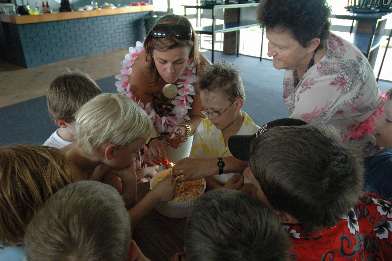 Tynan's 7th birthday party: Lighting candles on birthday cake