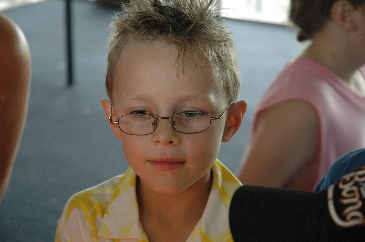 Tynan's 7th birthday party: Tynan waiting while everybody sings \