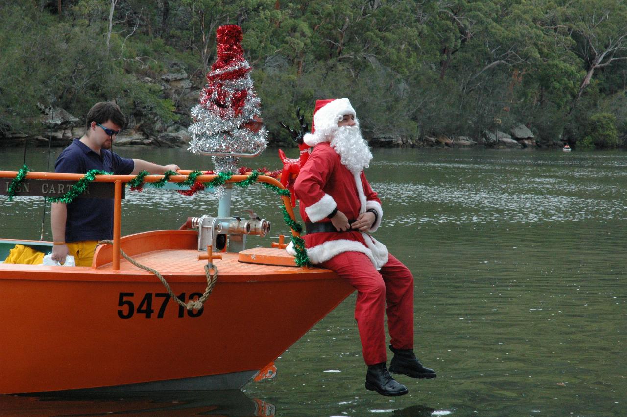 Christmas on Woronora: Santa's approaching the steps next to Cameron and Michelle's