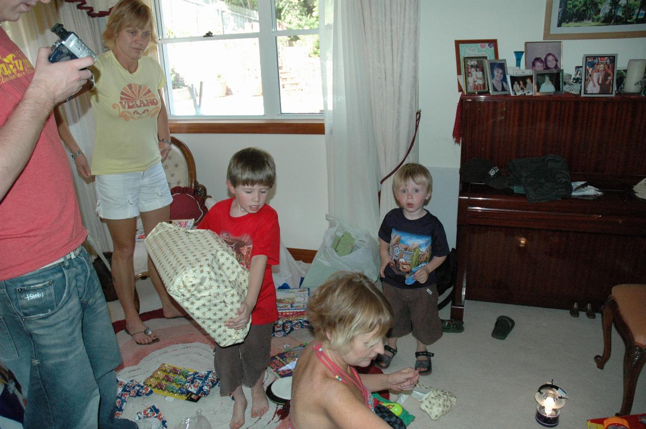 Christmas at Currey's: Chaos as presents are opened: Keiran, Kelly, Jake (carrying my present) Michelle and Flynn