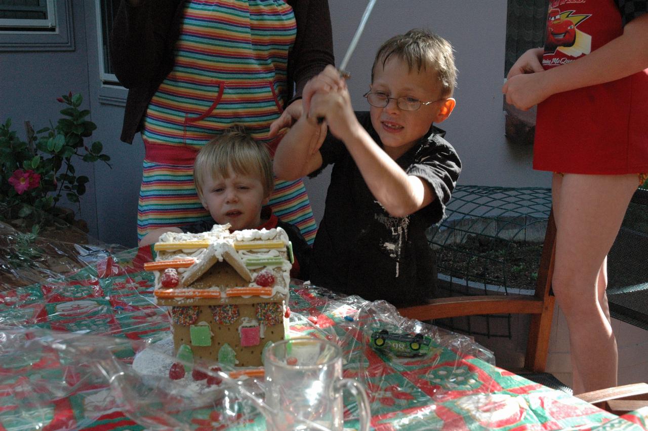 Christmas at Currey's: Tynan using heavy machinery to break the gingerbread house