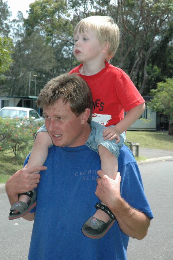 Flynn hitching a ride with Cam for Bendalong afternoon walk