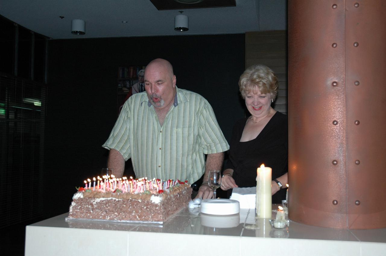 Peter blowing out the 50 candles at his party at Fenner Hall, ANU