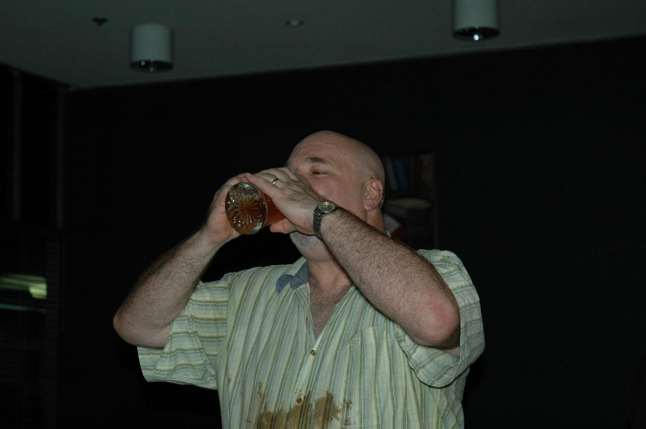 Old university tradition - drink the glass of beer in one gulp!  And he did.