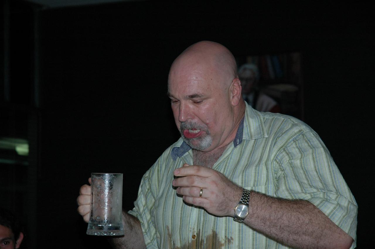 Old university tradition - drink the glass of beer in one gulp!  And he did.