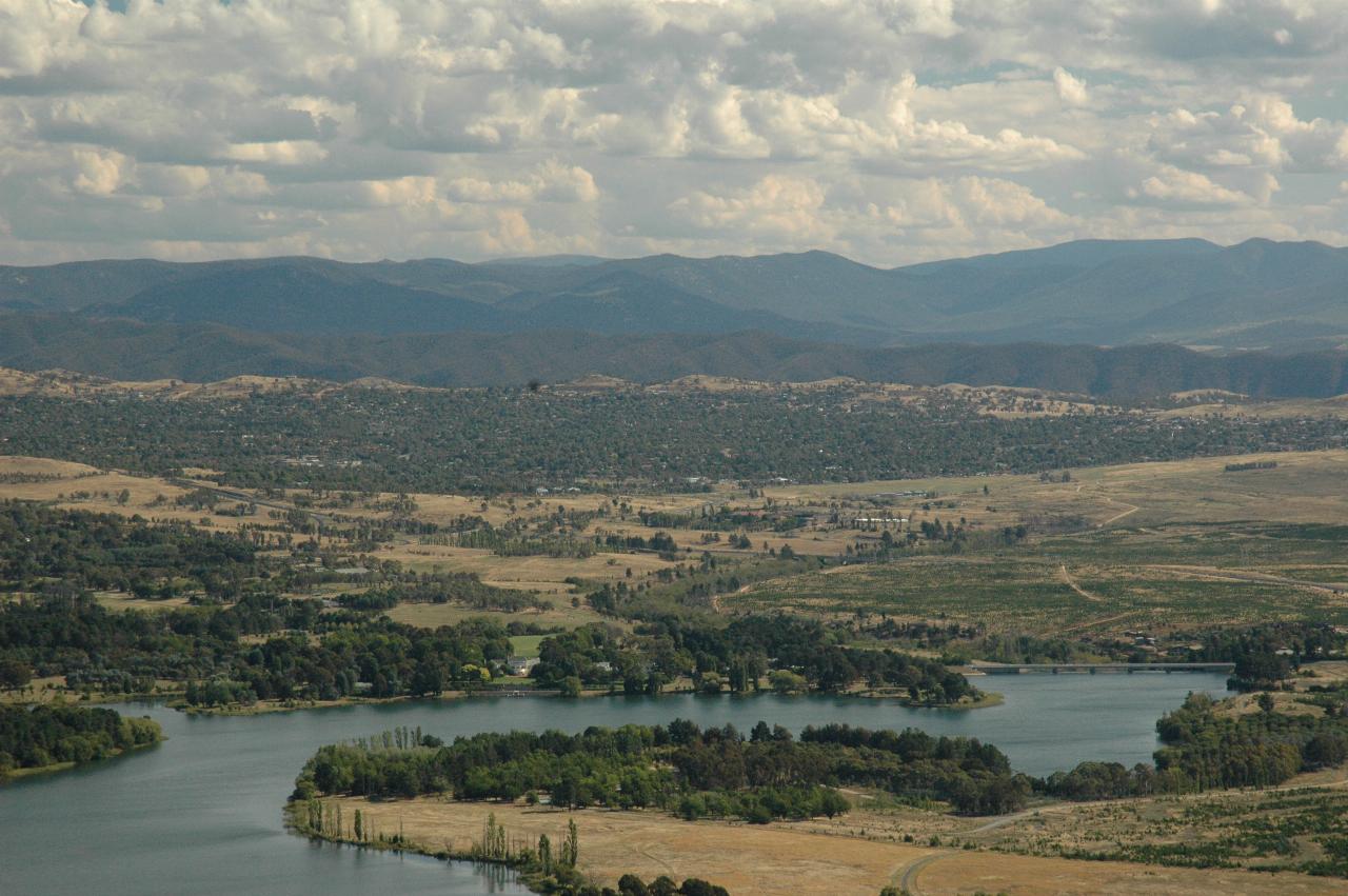 Looking roughly south from Telstra Tower, Yarralumla (Governor General's residence) on far shore of Lake Burley Griffin, and dam forming the lake on the right