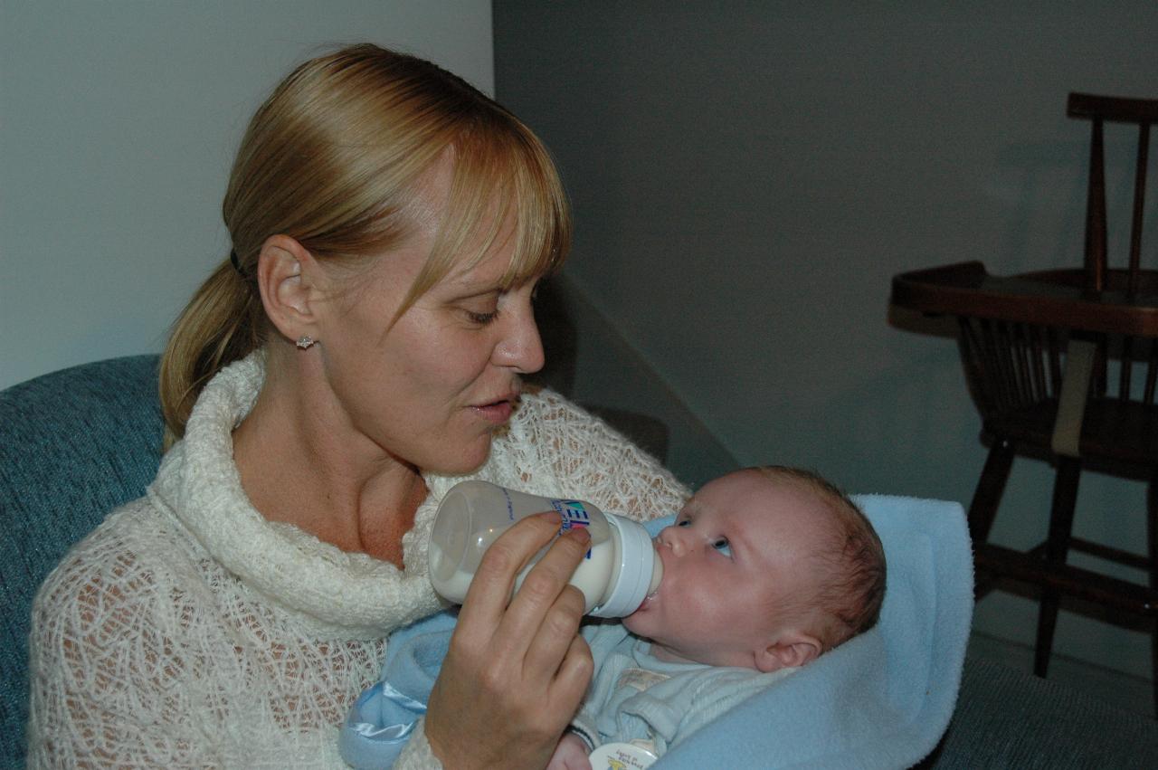 Kelly Wallace feeding baby Cooper at Yvonne's birthday