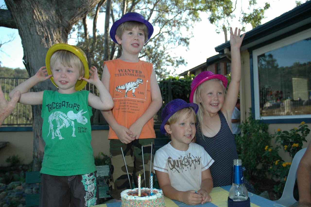 Flynn's third birthday: Flynn, Jake, Riley and Ellie with birthday hats