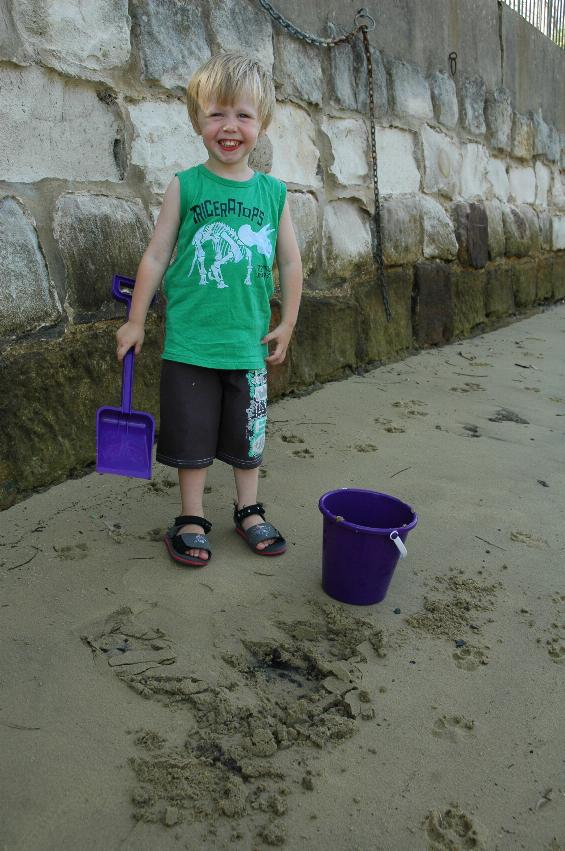 Flynn's third birthday: Flynn with spade and bucket on Croft's beach at Woronora