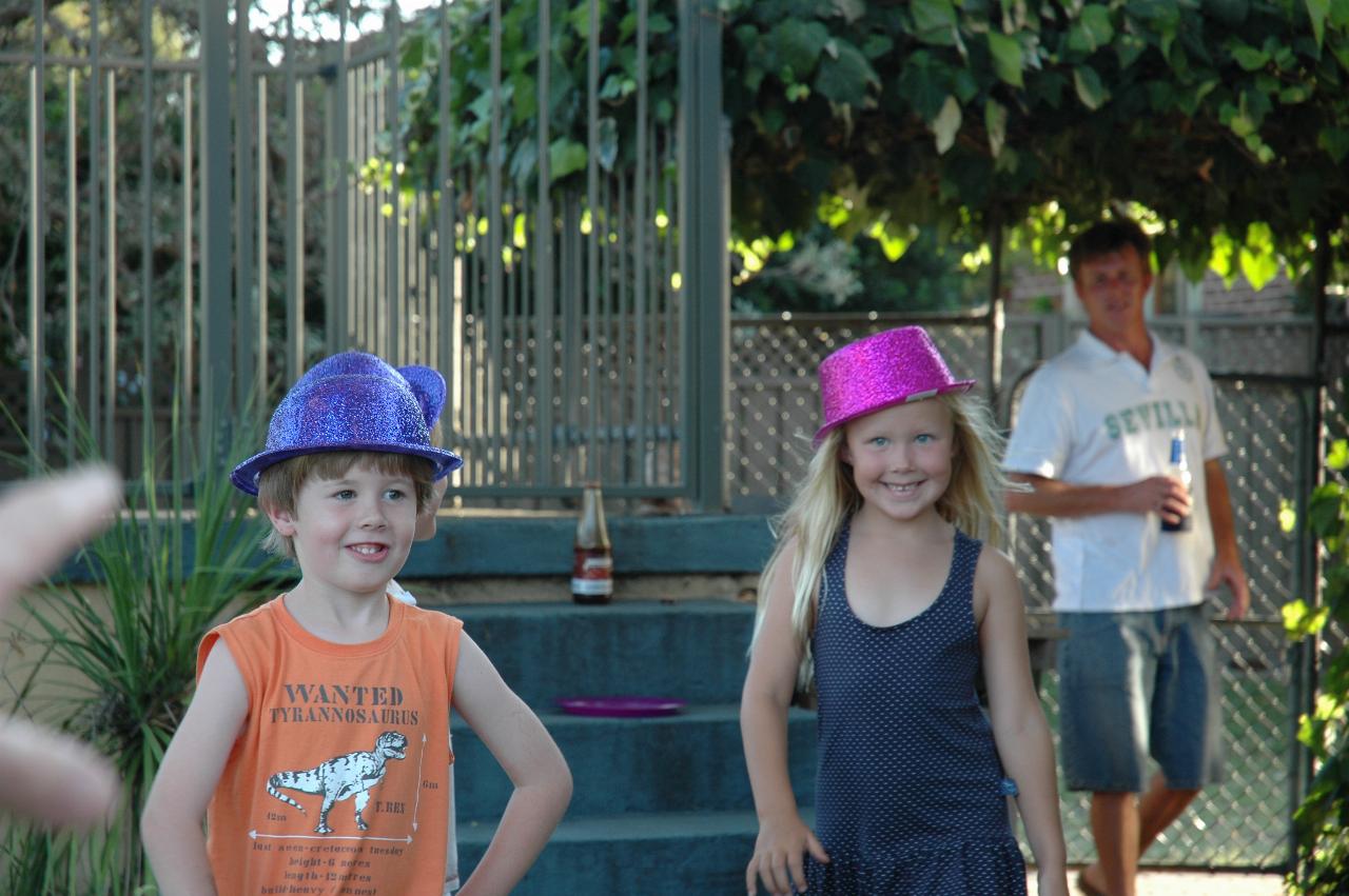 Flynn's third birthday: Jake and Ellie with birthday hats