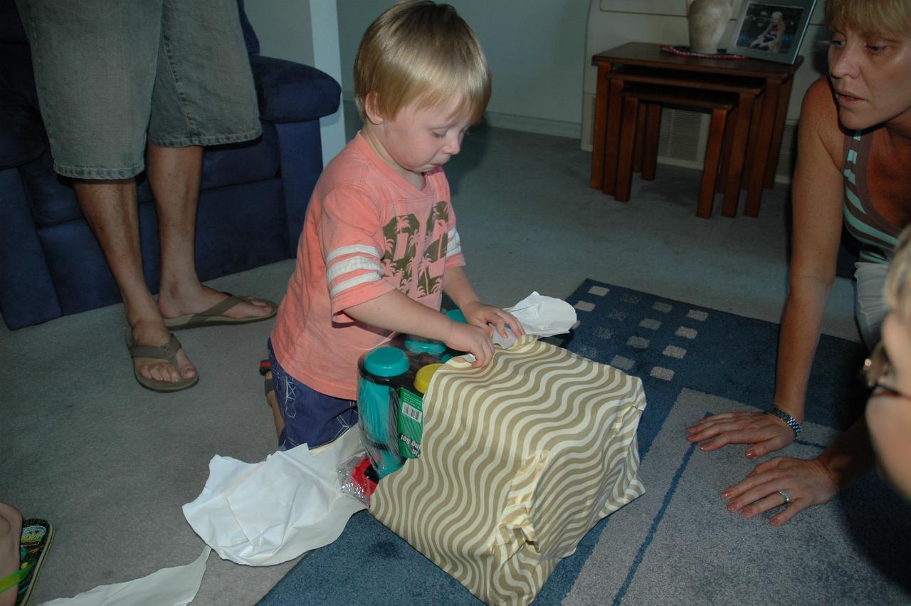 Cooper's First Birthday: Flynn opening a late present from Glenn & Kelly