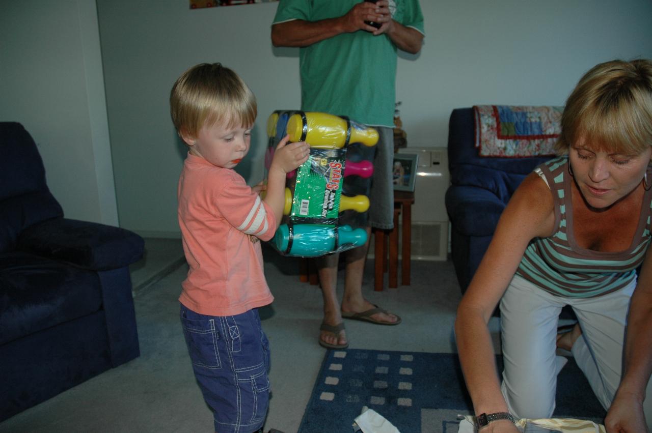 Cooper's First Birthday: Flynn opening a late present from Glenn & Kelly