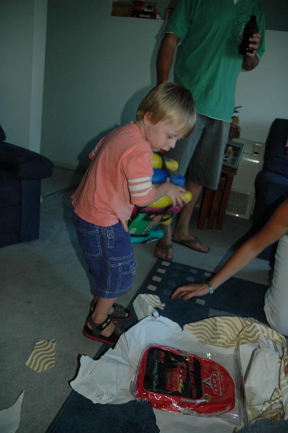 Cooper's First Birthday: Flynn opening a late present from Glenn & Kelly